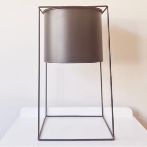 Black metal stand with planter
